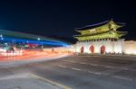 Geyongbokgung Palace And Car Light At Night In Seoul, South Korea Stock Photo