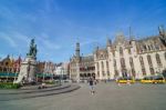 Bruges, Belgium - May 11, 2015: Tourist On Grote Markt Square In Stock Photo