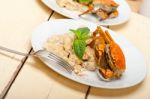 Italian Gnocchi With Seafood Sauce With Crab And Basil Stock Photo