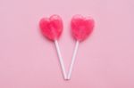 Two Pink Valentine's Day Heart Shape Lollipop Candy On Empty Pastel Pink Paper Background. Love Concept. Top View. Minimalism Colorful Hipster Style Stock Photo