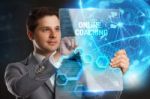 Business, Technology, Internet And Network Concept. Young Businessman Showing A Word In A Virtual Tablet Of The Future: Online Coaching Stock Photo