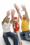 Young Friends With Raised Hands Stock Photo