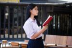 Asia Thai High School Student Uniform Beautiful Girl Read A Book Stock Photo