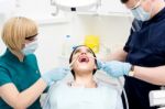 Dental Cleaning, Woman Under Treatment Stock Photo