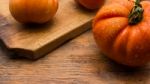 Freshly Picked Tomatoes, Place On Wooden Chopping Board And Table Stock Photo