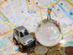 Miniature Traveller Or Backpacker Stand On Globe Of Glass, Euro Stock Photo