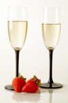 Champagne Flutes With Strawberries Stock Photo