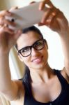 Cute Brunette Woman Taking Photo Of Herself Stock Photo