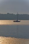 Isolated Picture With A Lake And Boat On Sunset Stock Photo