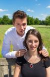 Man Giving Heart Necklace To Young Attractive Woman Stock Photo