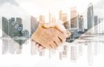 Double Exposure Handshake Of Business Peoples Stock Photo