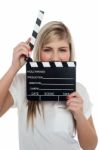 Beautiful Female With Clapperboard. It's Showtime Stock Photo