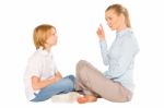 Mum And Son Sat On The Floor Smiling Isolated On White Backgroun Stock Photo