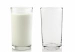 Glass And Glass Of Milk Isolated On White Background Stock Photo