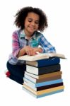 Smiling School Girl Reading A Book Stock Photo