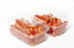 Cherry Tomato In Plastic Container Package, Studio Shoot On Whit Stock Photo