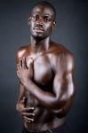 Beautiful And Muscular Man In Dark Background Stock Photo