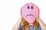 Pink Balloon With Expression In Front  Of Girls Face Stock Photo