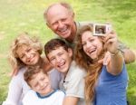 Family Outdoors Taking Self Portrait Stock Photo