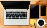 Laptop Computer Tablet Phone And Coffee Drink On Wood Workspace Stock Photo