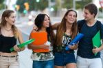 A Group Of Friends Talking In The Street After Class Stock Photo