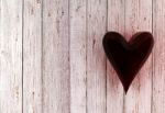 Red Glass Heart On White Wood Background Stock Photo