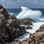 Waves Pounding The Coastline At Capo Testa Sardinia Stock Photo