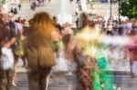 Blurry People Walking In The Street Stock Photo