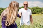 Girlfriend Pulling Her Boyfriend In Love Stock Photo