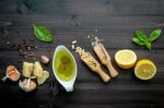 The Ingredients For Green Pesto Sauce On Dark Wooden Background Stock Photo