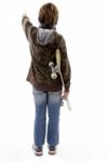 Back Pose Of Pointing Boy Holding Skateboard Stock Photo