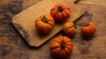 Freshly Picked Tomatoes, Place On Wooden Chopping Board And Table Stock Photo