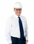 Smiling Aged Engineer With Hard Hat Stock Photo