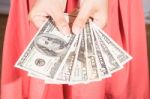 A Woman Hold Dollar Banknote In Hand Stock Photo