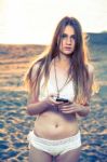 Girl With Smart Phone Near Beach Stock Photo