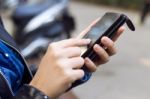 Beautiful Young Woman Using Her Mobile Phone In The Street Stock Photo