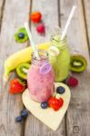 Fresh Blended Fruit Smoothies In Vintage Milk Bottles Stock Photo