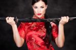 Woman Holding Katana Weapon Stock Photo