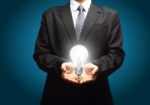 Light Bulb In Hand Stock Photo