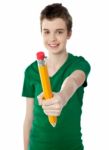 schoolBoy Showing Big Yellow Pencil Stock Photo