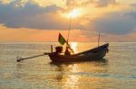 Beautiful  Fishing Boat Floating With Golden Sunrise Light Backg Stock Photo