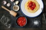 Pureed Tomatoes In A Ceramic Dish And A Plate With Spaghetti On Stock Photo