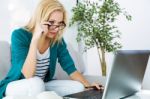 Pretty Young Woman Working With Laptop At Home Stock Photo