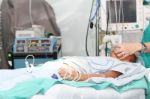 Unidentified Patient Receiving Oxygen By A Breathing Mask Holded Stock Photo