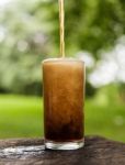 Cola Pouring In A Glass Stock Photo