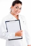 Young Female Doctor Holding Writing Pad Stock Photo