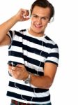 Young Male Listening Music Stock Photo