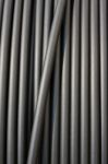 Close-up Of Black Electricity Cable Verticla On A Spool Stock Photo