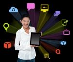 Smilng Woman With Tablet And Colourful Icons Stock Photo