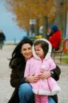 Young Woman With A Little Girl Stock Photo